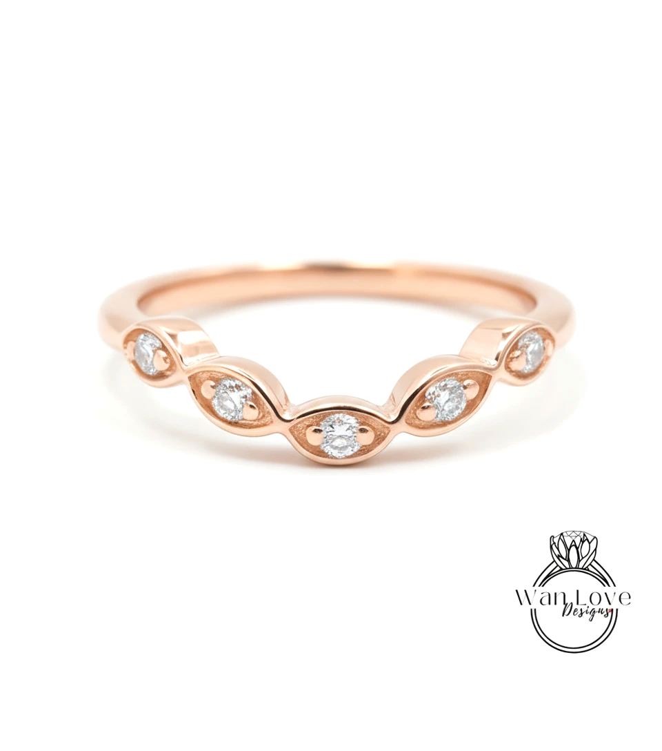 A rose gold ring with a row of small diamonds set in the center.