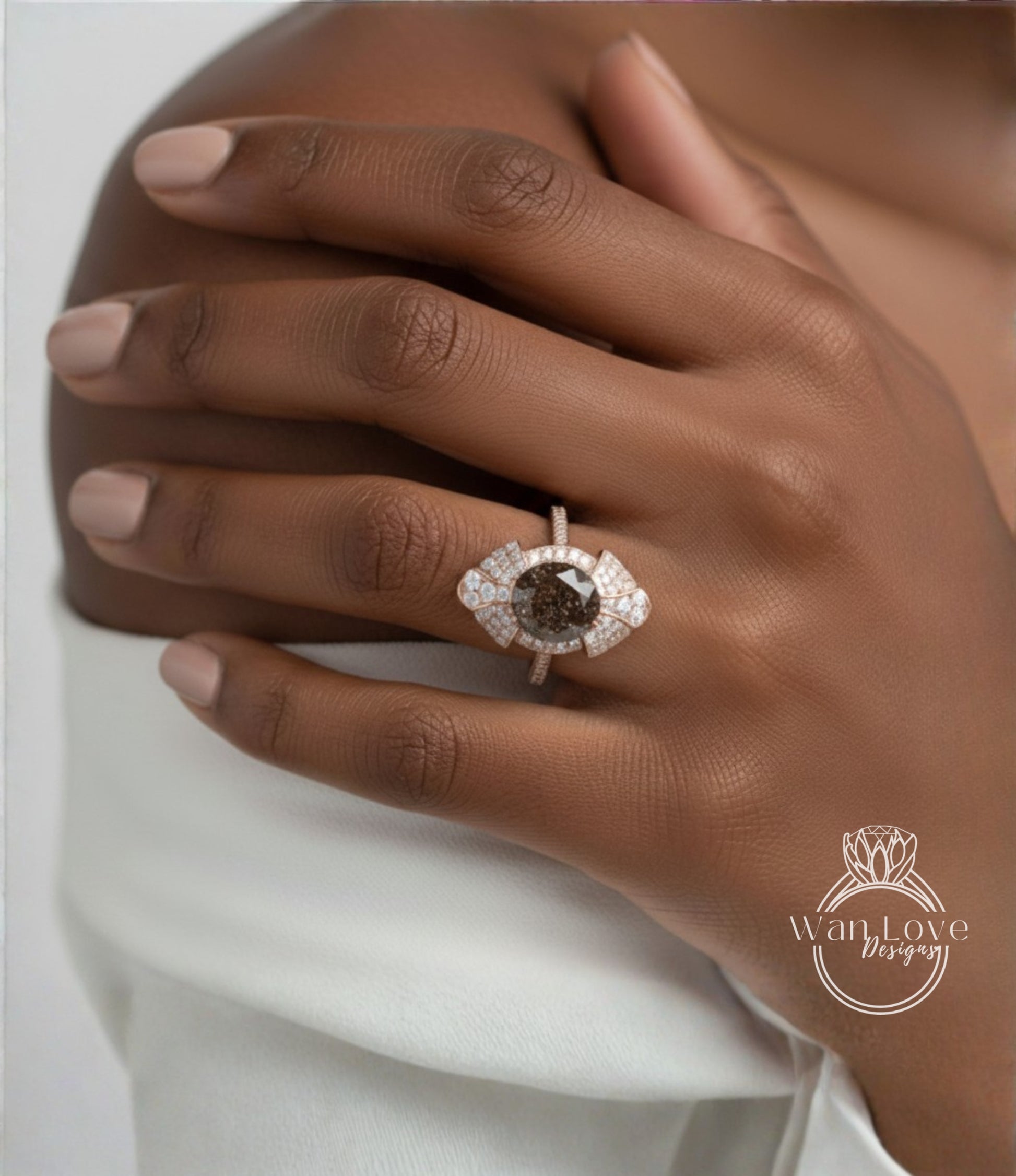 A close-up of a hand wearing a large, ornate ring with a large central stone surrounded by smaller stones.