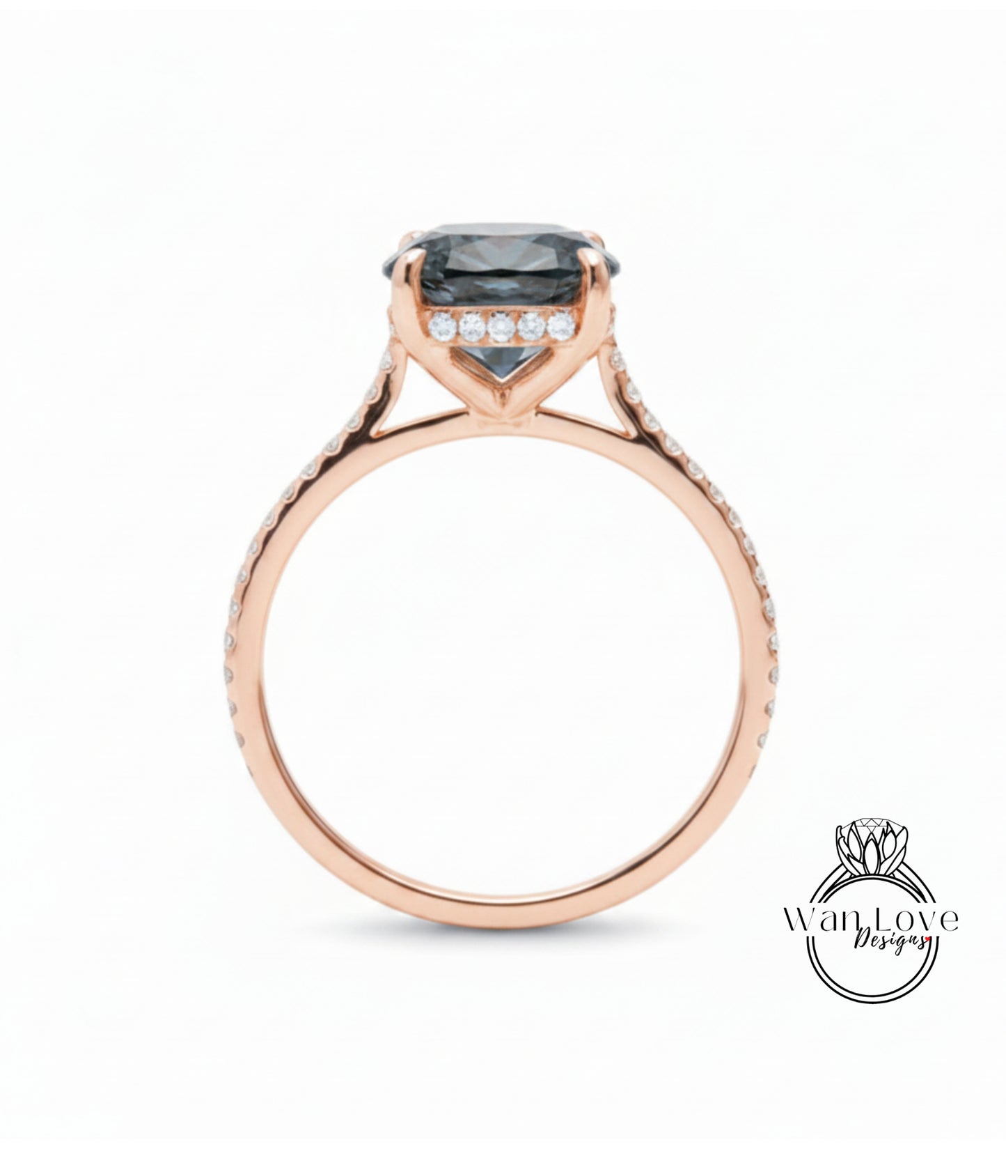 A rose gold engagement ring with a large blue gemstone set in the center, surrounded by smaller diamonds.