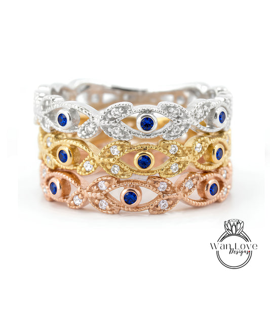 A ring with multiple layers of rings, each with a blue gemstone in the center. The rings are arranged in a decorative pattern, creating a visually appealing design.