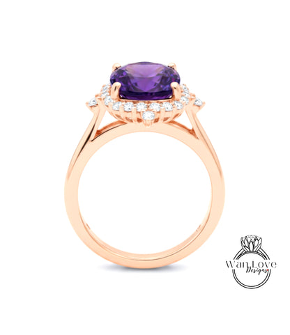 A gold ring with a large purple gemstone set in the center, surrounded by smaller diamonds.