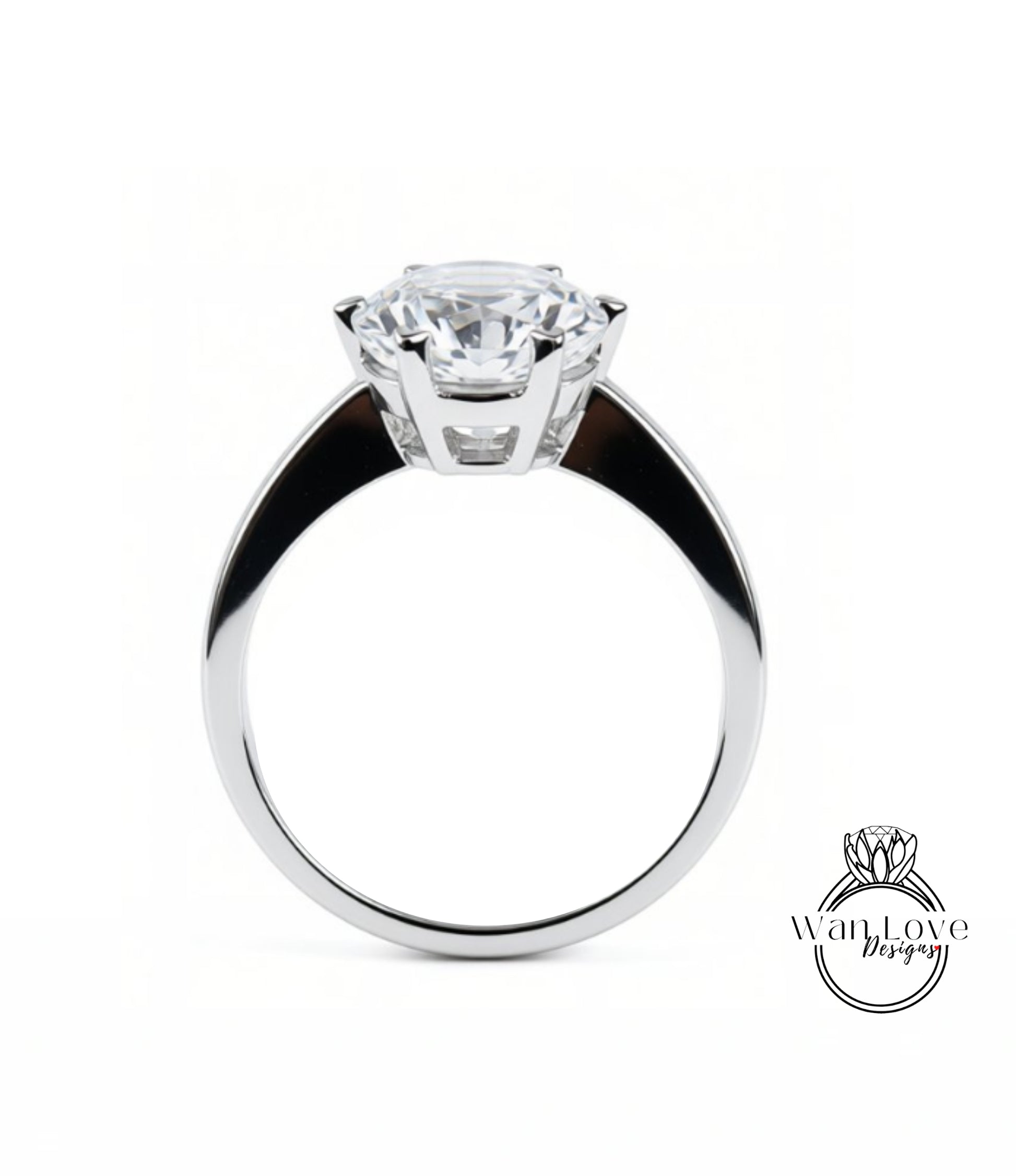 A close-up of a silver ring with a large, clear gemstone set in the center.