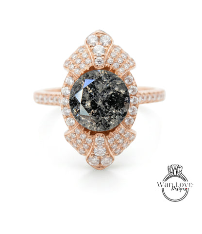 a beautiful ring with a large black diamond as the centerpiece, surrounded by numerous smaller diamonds.