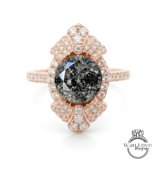 a beautiful ring with a large black diamond as the centerpiece, surrounded by numerous smaller diamonds.
