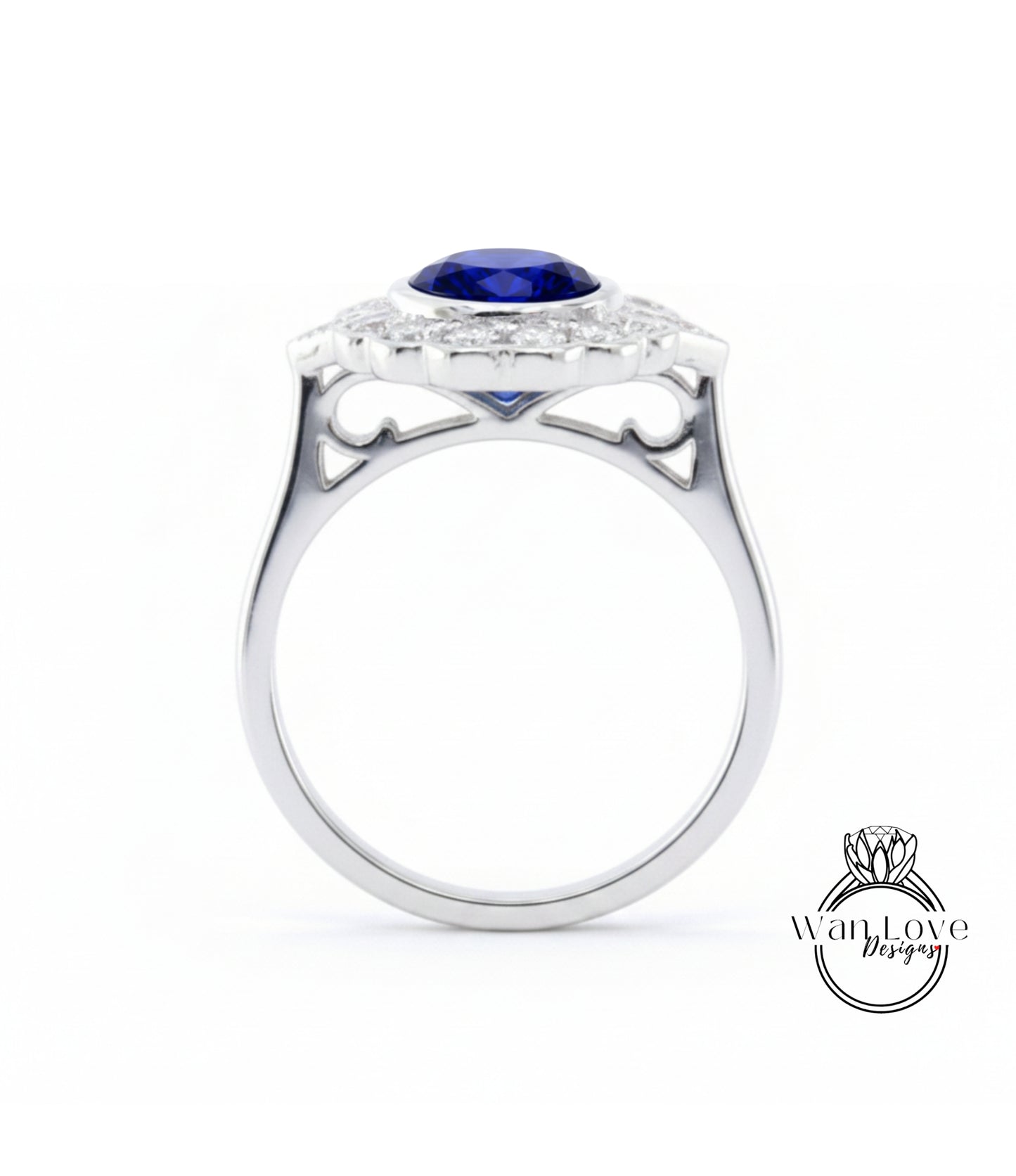 A silver ring with a large blue gemstone set in the center, surrounded by smaller diamonds.