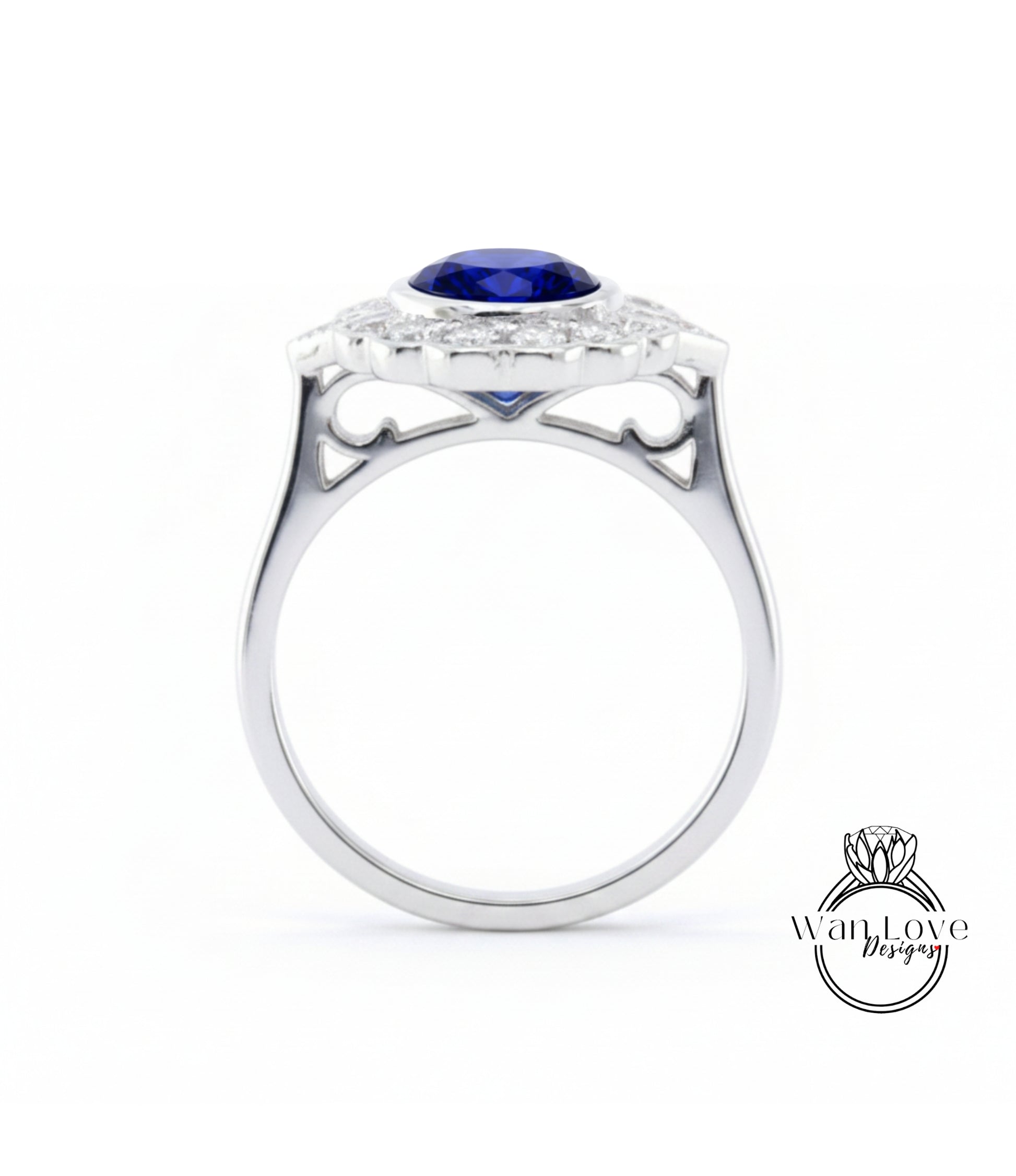 A silver ring with a large blue gemstone set in the center, surrounded by smaller diamonds.