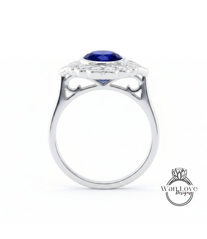 A silver ring with a large blue gemstone set in the center, surrounded by smaller diamonds.