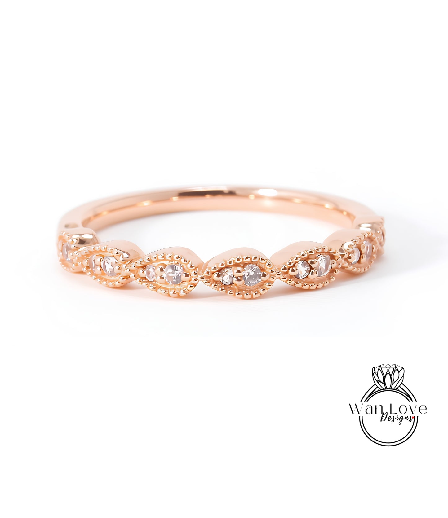 A rose gold ring with a row of small diamonds set in the center.
