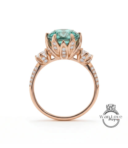 A gold ring with a large, round gemstone at the center, surrounded by smaller diamonds.