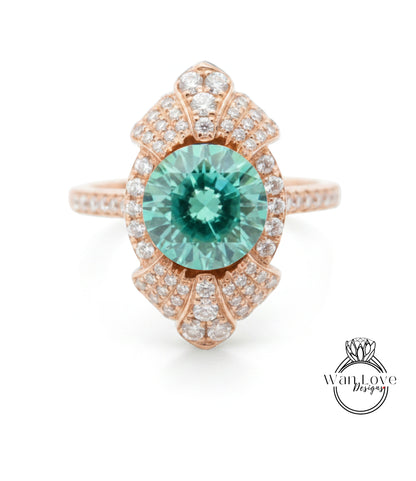 a beautiful ring with a large, round, green gemstone at the center, surrounded by a decorative design with numerous small diamonds.