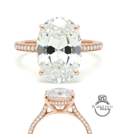 a large, oval-shaped diamond engagement ring with a rose gold band and a row of small diamonds along the band.