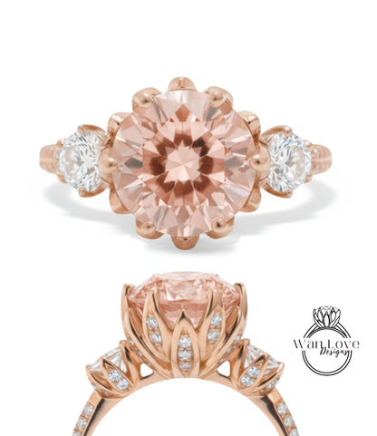 a beautiful pink gemstone ring with a large central gemstone surrounded by smaller gemstones and a delicate floral design.