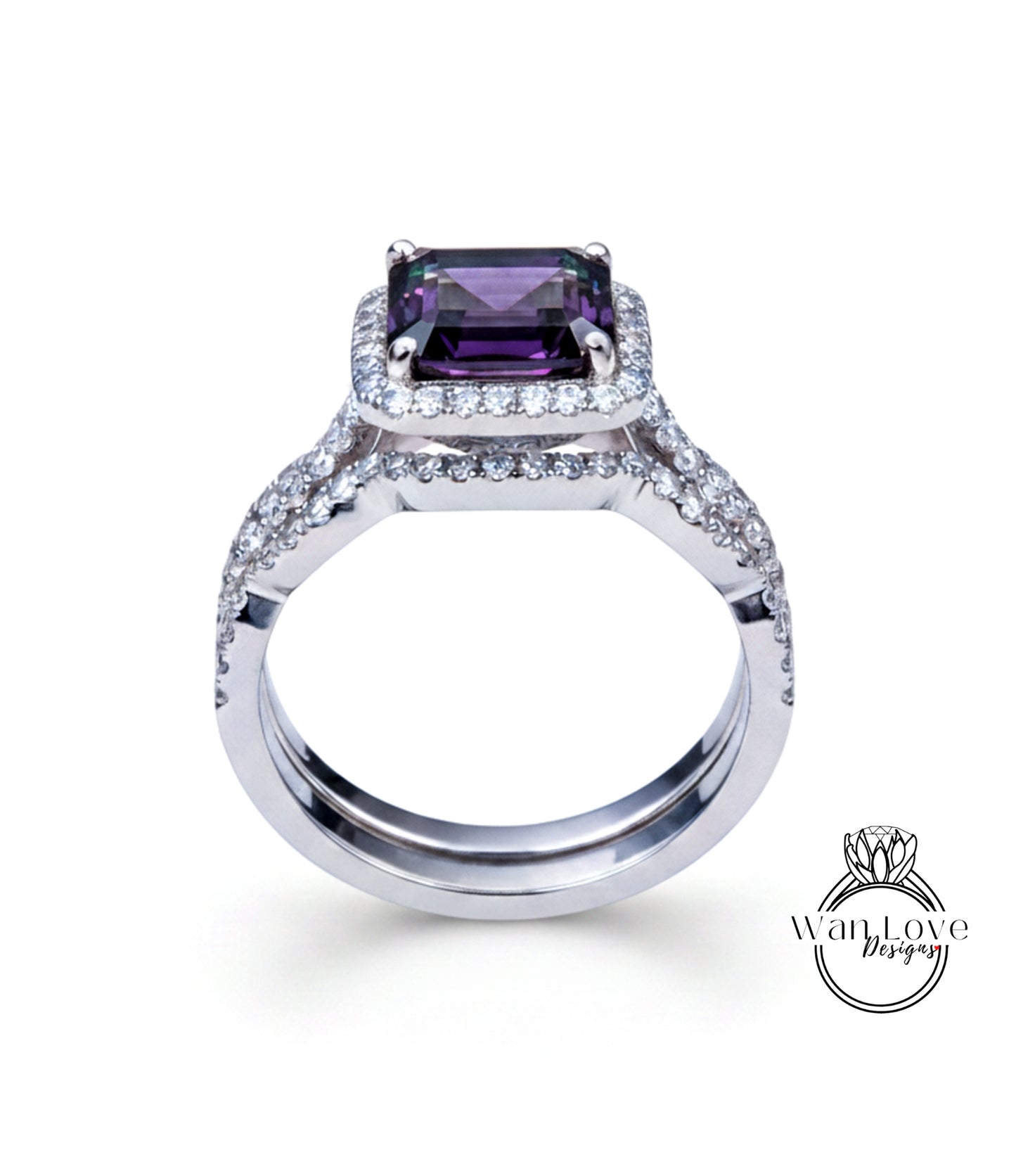 A silver ring with a large purple gemstone, likely a diamond, set in the center.