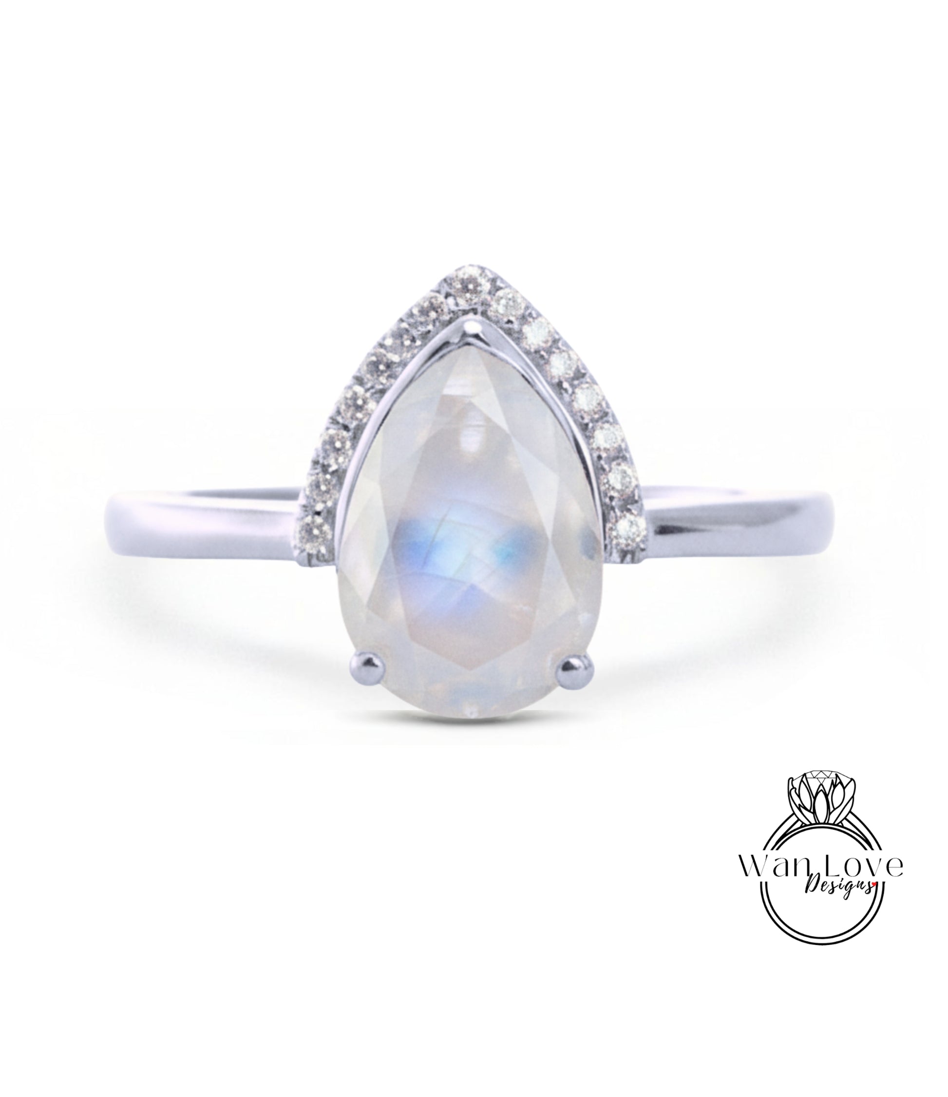 A silver ring with a large, clear gemstone in the center, surrounded by smaller diamonds.