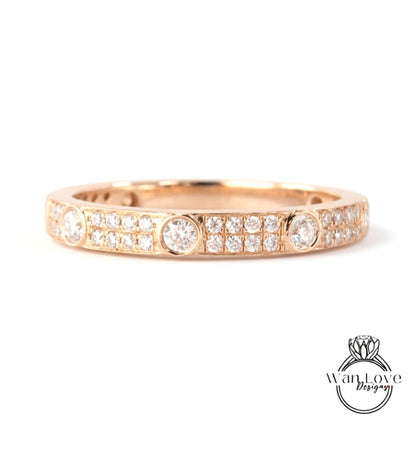A gold ring with a row of small diamonds set in the band.
