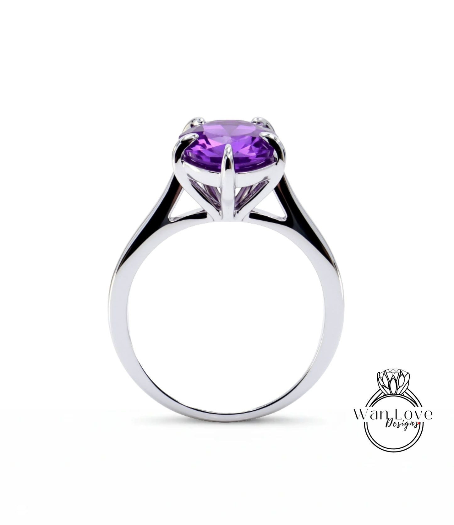 A silver ring with a large, purple gemstone set in the center.