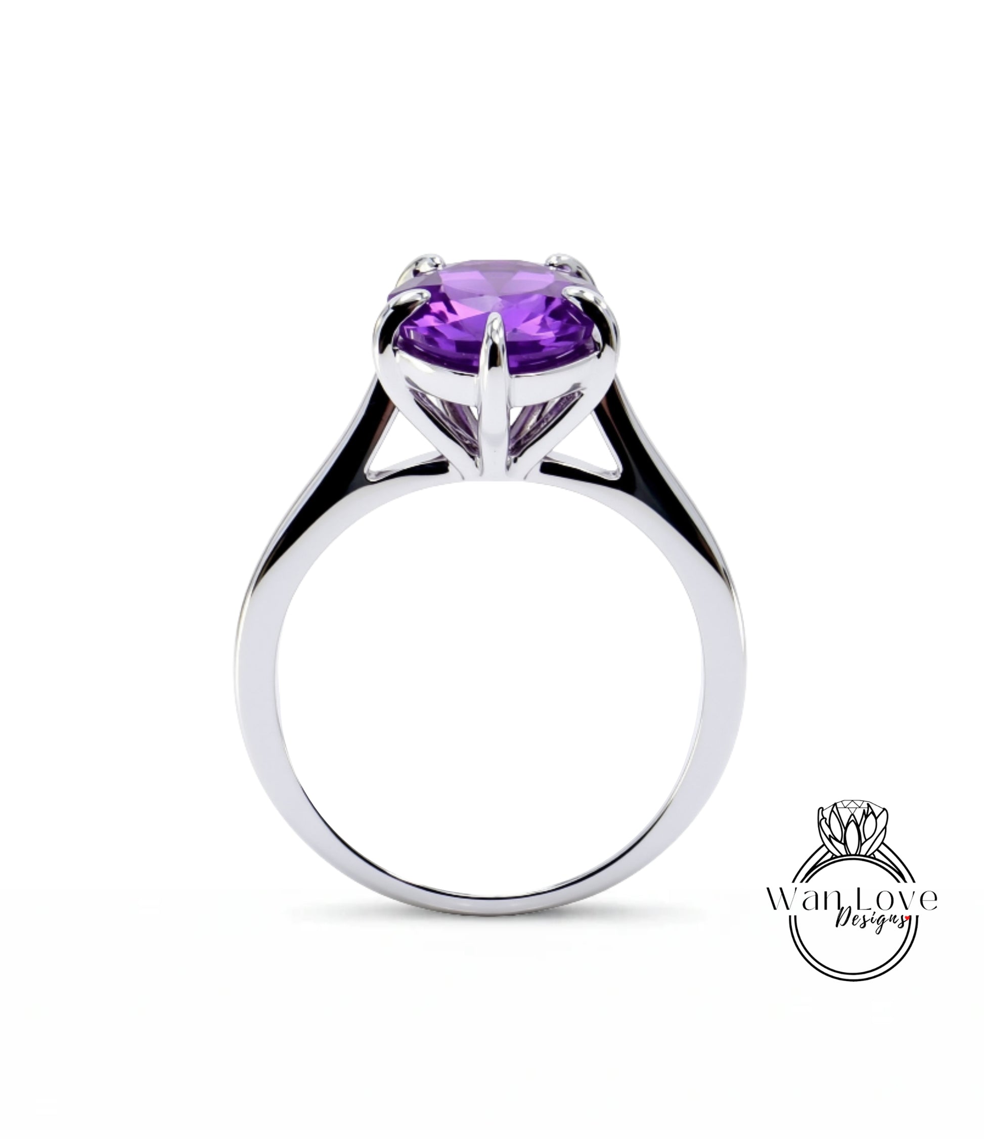 A silver ring with a large, purple gemstone set in the center.