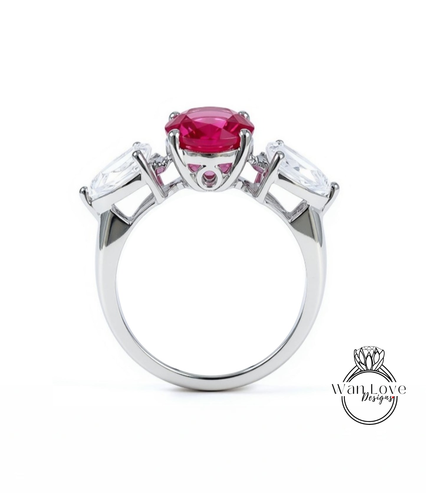 A silver ring with a large pink gemstone in the center, surrounded by smaller white gemstones.