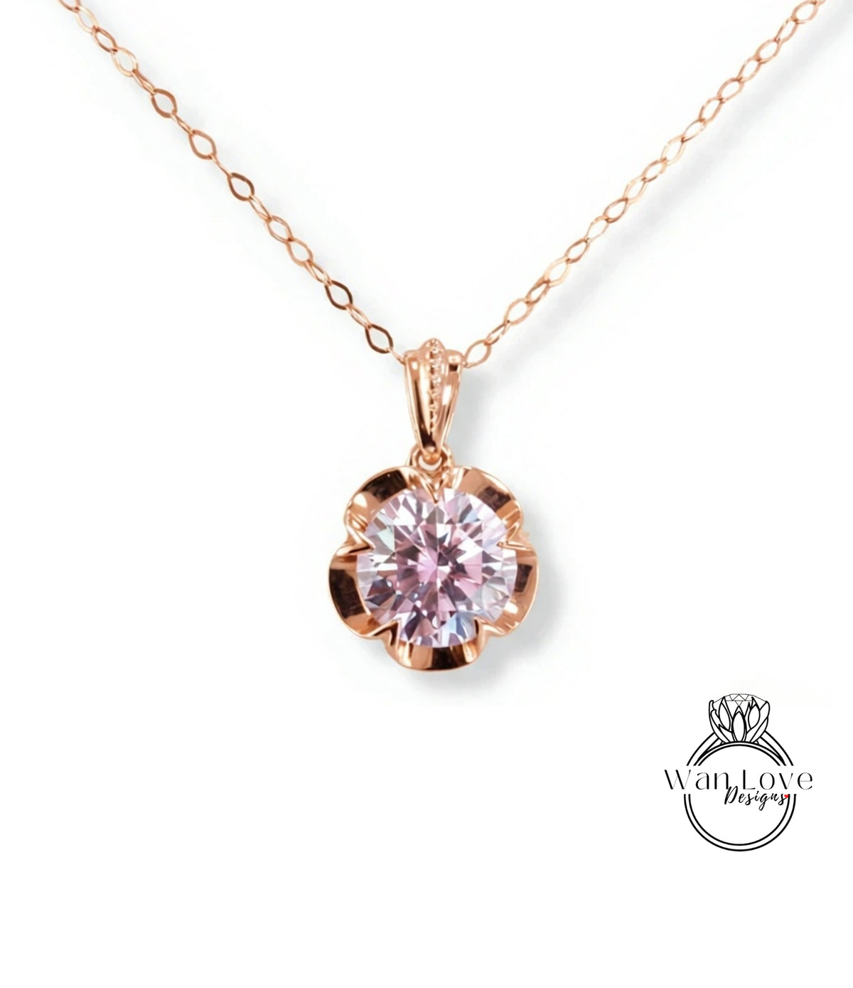 A delicate rose gold necklace with a large, round pink gemstone pendant.