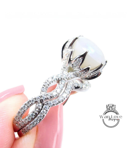 A close-up of a diamond ring being held in a hand, showcasing the intricate design and sparkling gemstones.