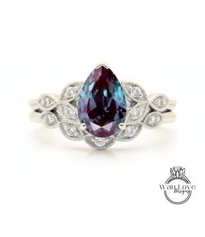 A silver ring with a large, deep purple gemstone at the center, surrounded by smaller diamonds.