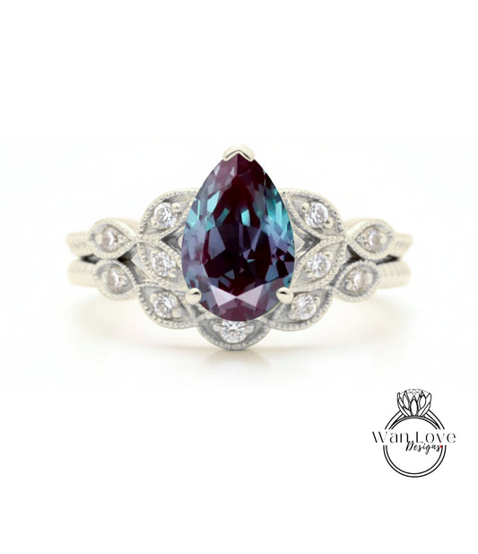 A silver ring with a large, deep purple gemstone at the center, surrounded by smaller diamonds.