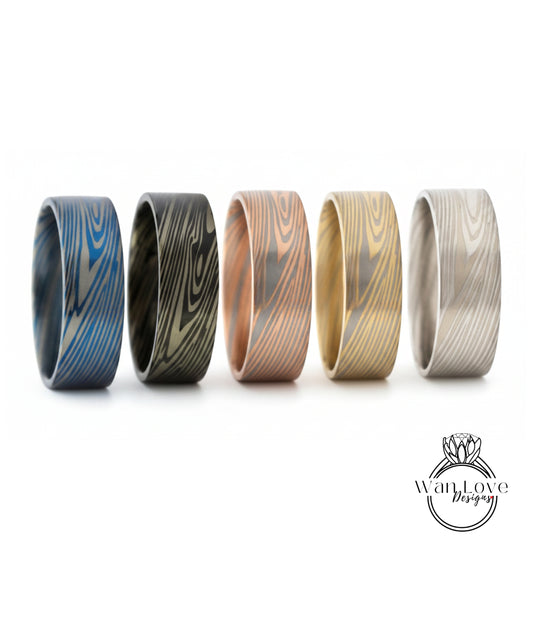 five rings with unique wood grain patterns, each in a different color.
