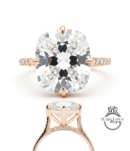 A large, clear diamond engagement ring with a gold band and a prominent central diamond.