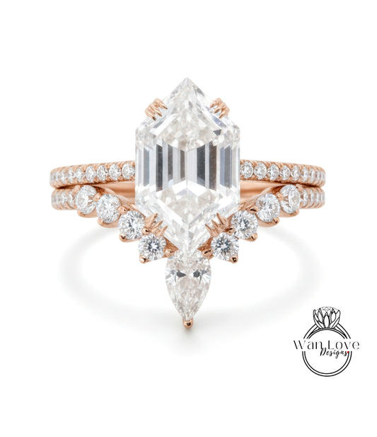 a beautiful diamond engagement ring with a large central diamond surrounded by smaller diamonds on either side.