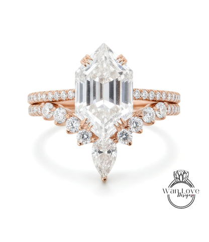 a beautiful diamond engagement ring with a large central diamond surrounded by smaller diamonds on either side.