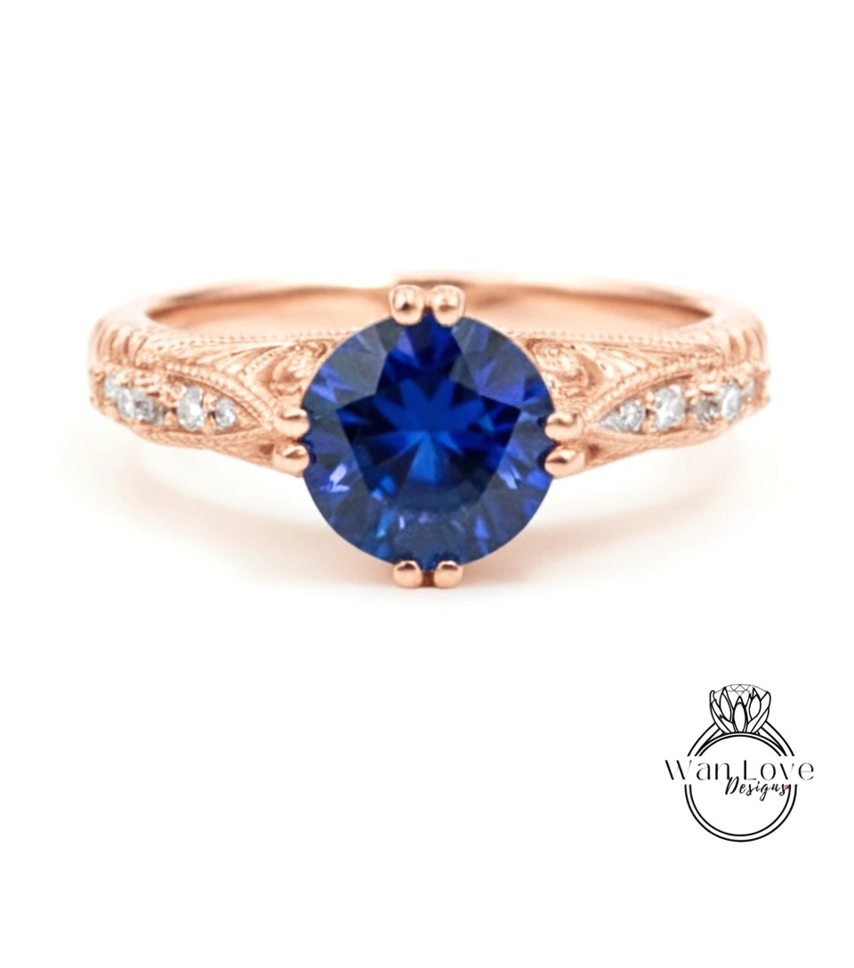 a beautiful rose gold ring with a large blue gemstone at the center.