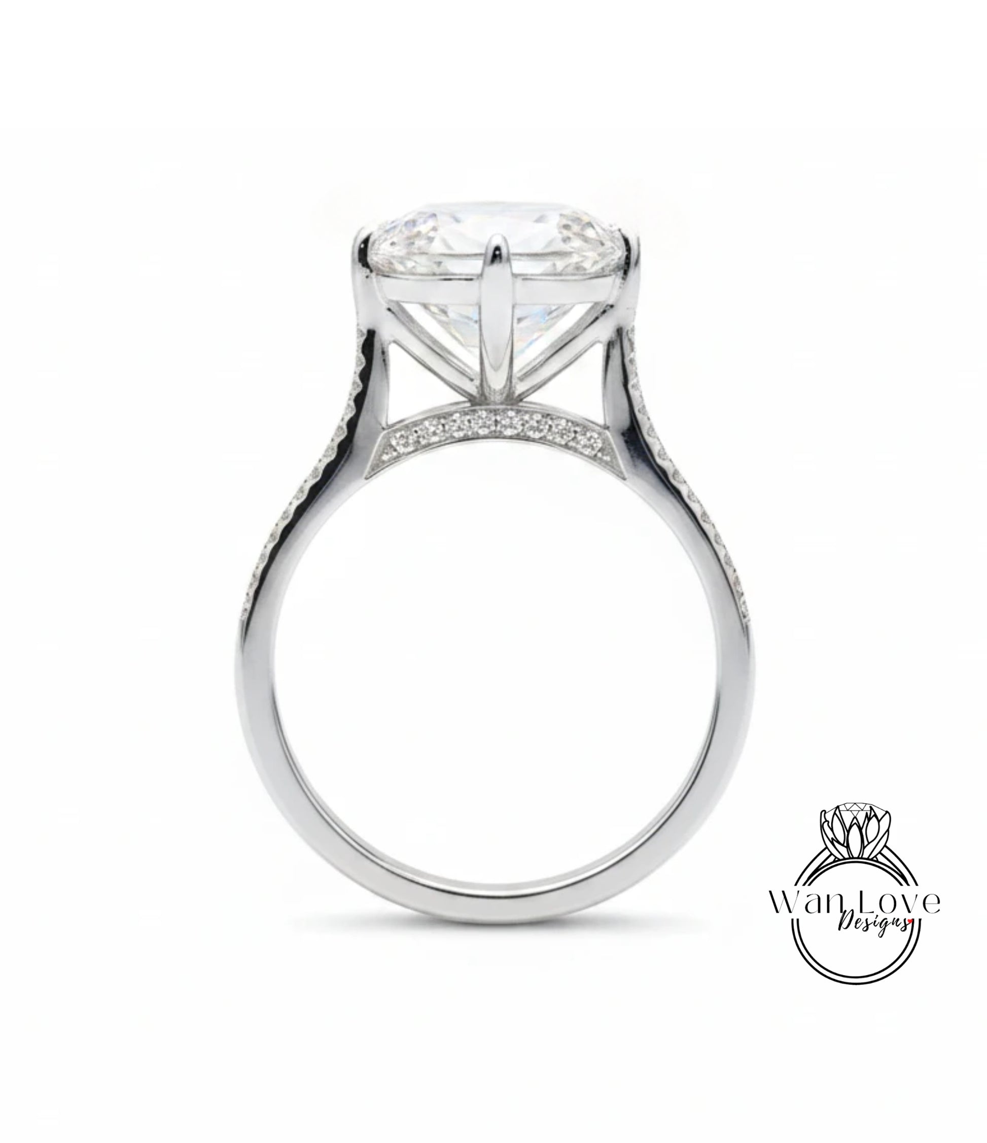 A large, elegant engagement ring with a large central diamond and a delicate band adorned with small diamonds.
