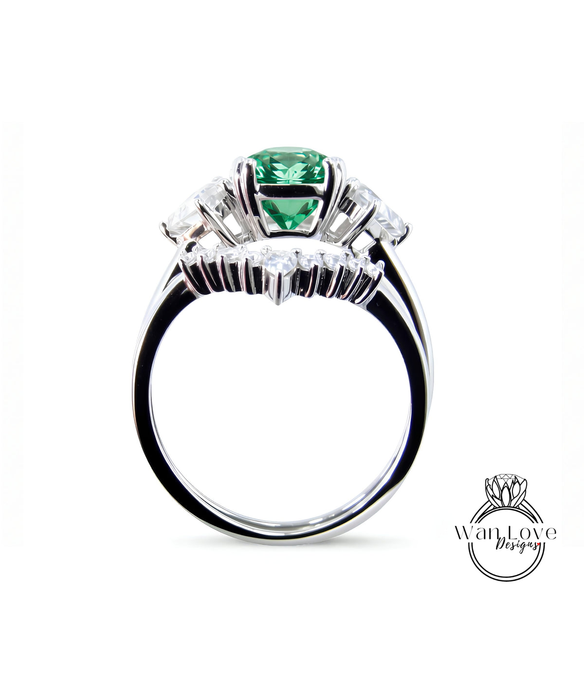 A silver ring with a large green gemstone, surrounded by smaller diamonds, is shown against a white background.