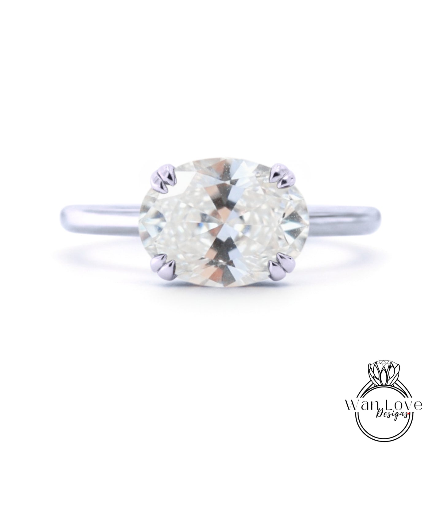 A close-up view of a diamond engagement ring with a large, round brilliant cut diamond set in a silver band.
