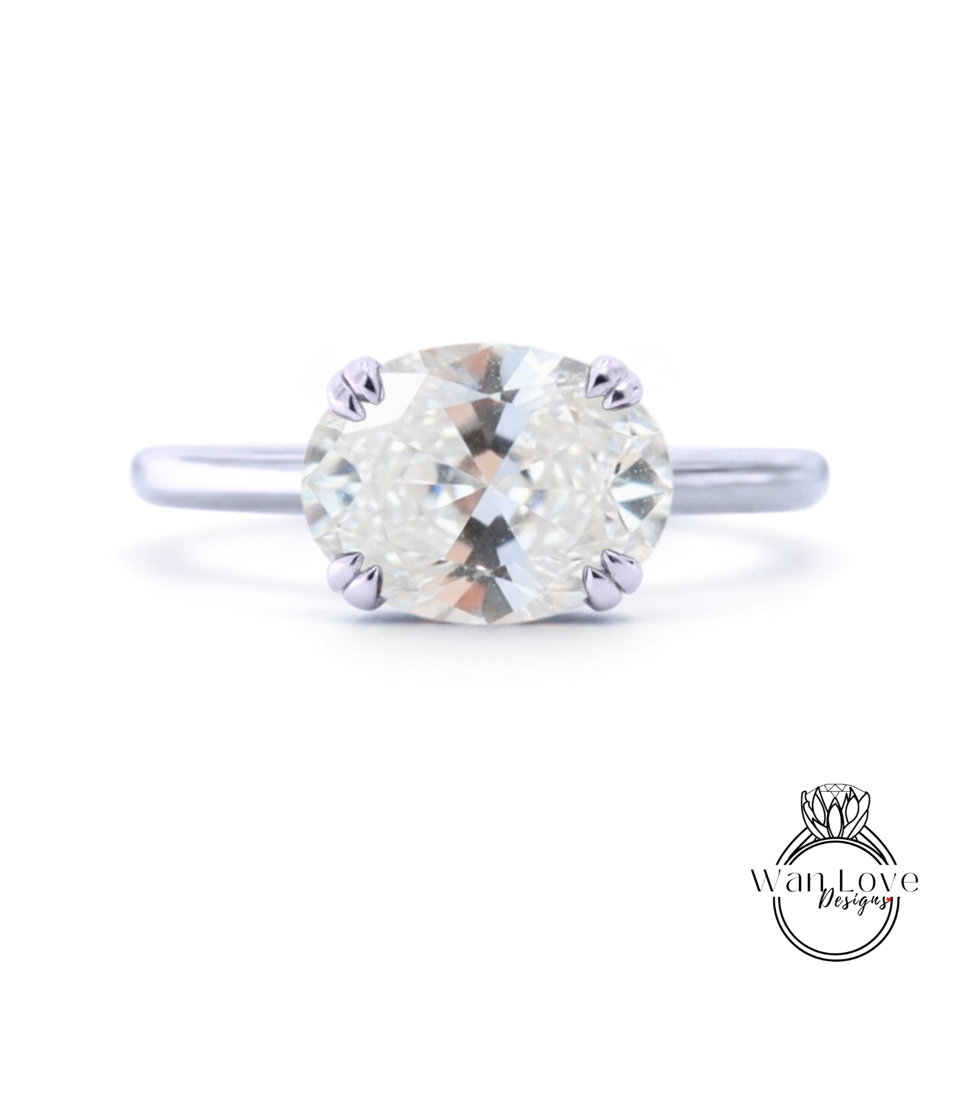 A close-up view of a diamond engagement ring with a large, round brilliant cut diamond set in a silver band.