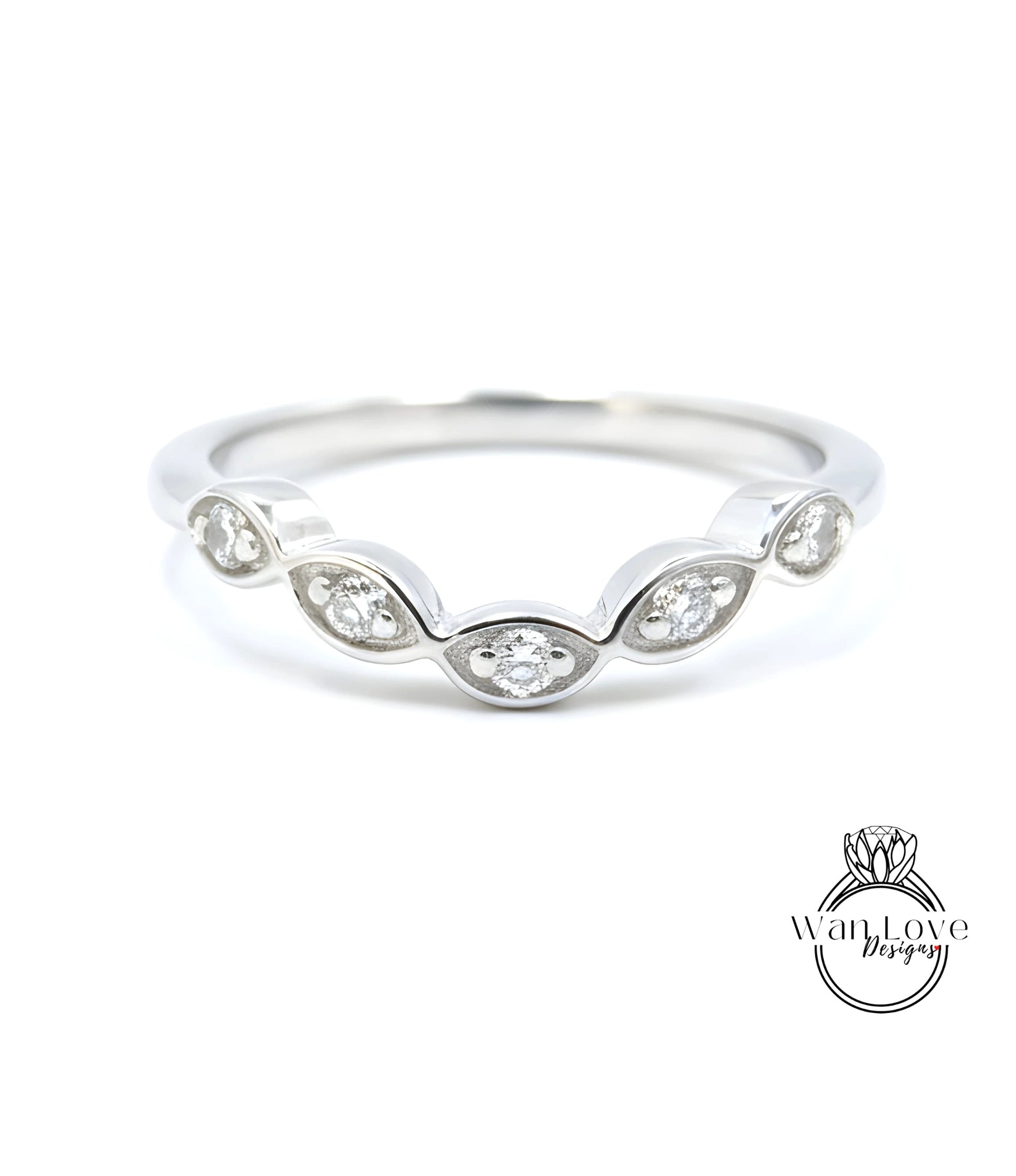 A silver ring with a row of small diamonds set in the center.