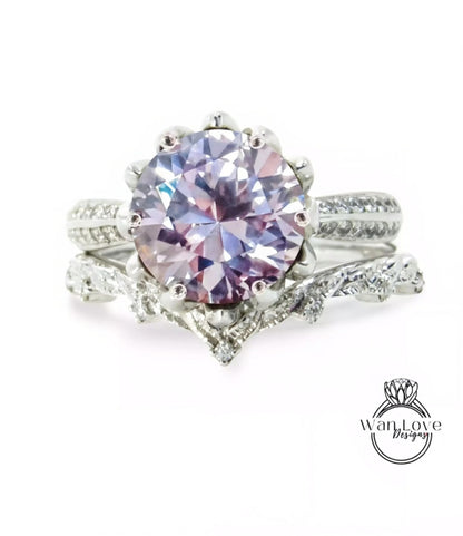 A stunning engagement ring with a large, round purple gemstone set in a silver band, surrounded by smaller diamonds.