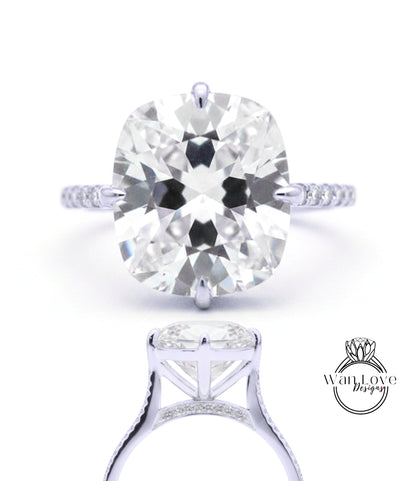 A large, round diamond engagement ring with a silver band and pavé setting.