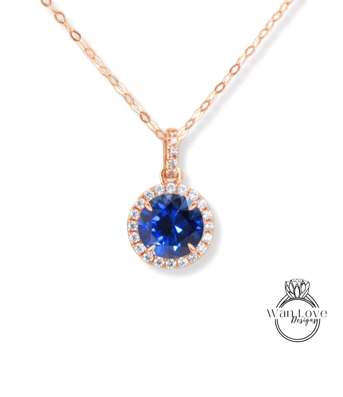 A necklace with a large blue gemstone pendant, surrounded by a halo of smaller diamonds.