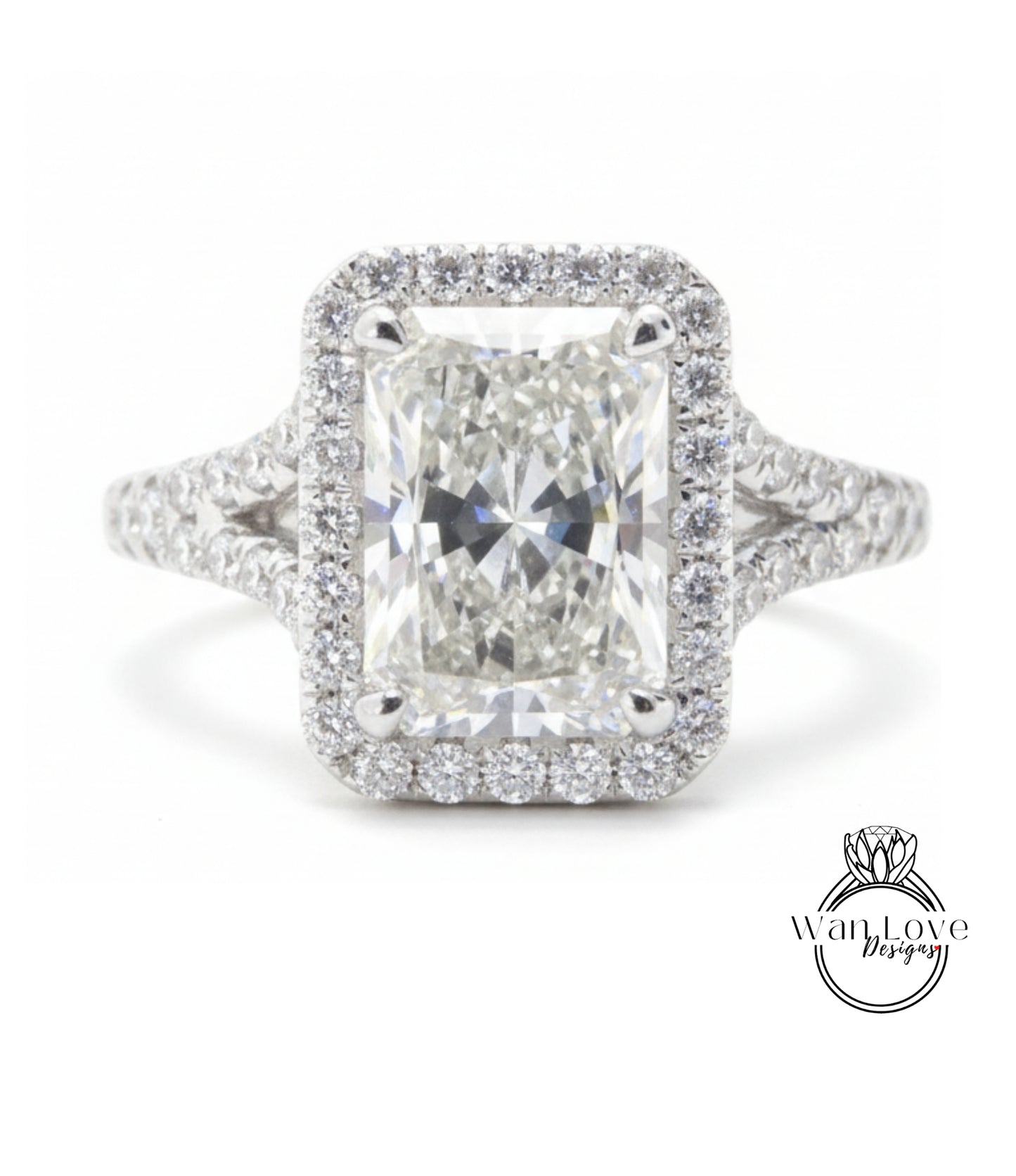A stunning diamond engagement ring with a large central diamond surrounded by a halo of smaller diamonds set in a silver band.