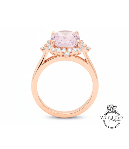 A rose gold ring with a large pink gemstone set in the center, surrounded by smaller diamonds.