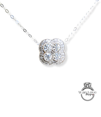 A necklace with a large, sparkling diamond pendant.