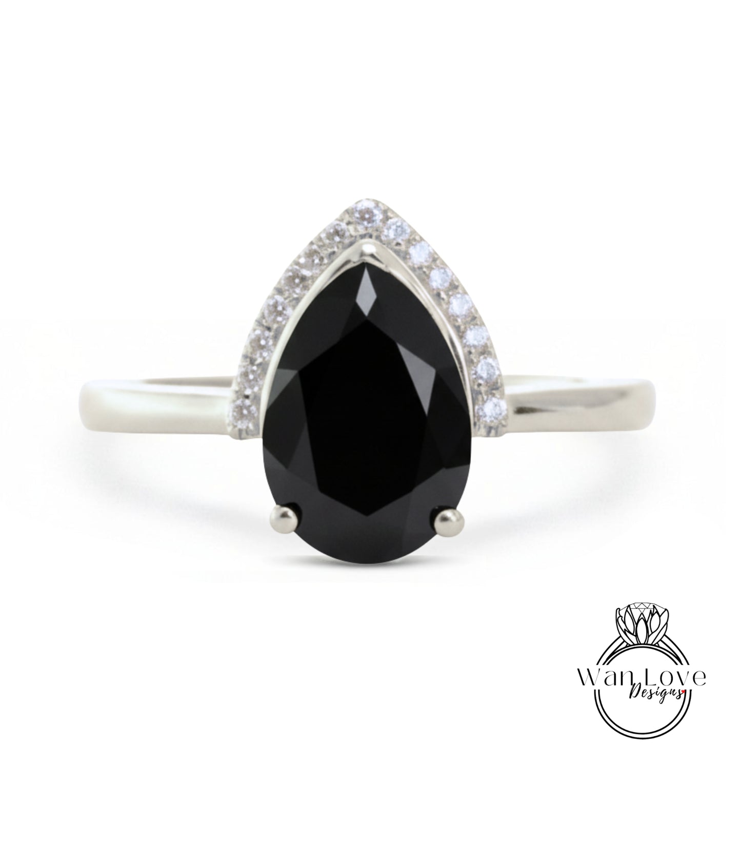 A silver ring with a large black diamond as the centerpiece, surrounded by smaller diamonds.