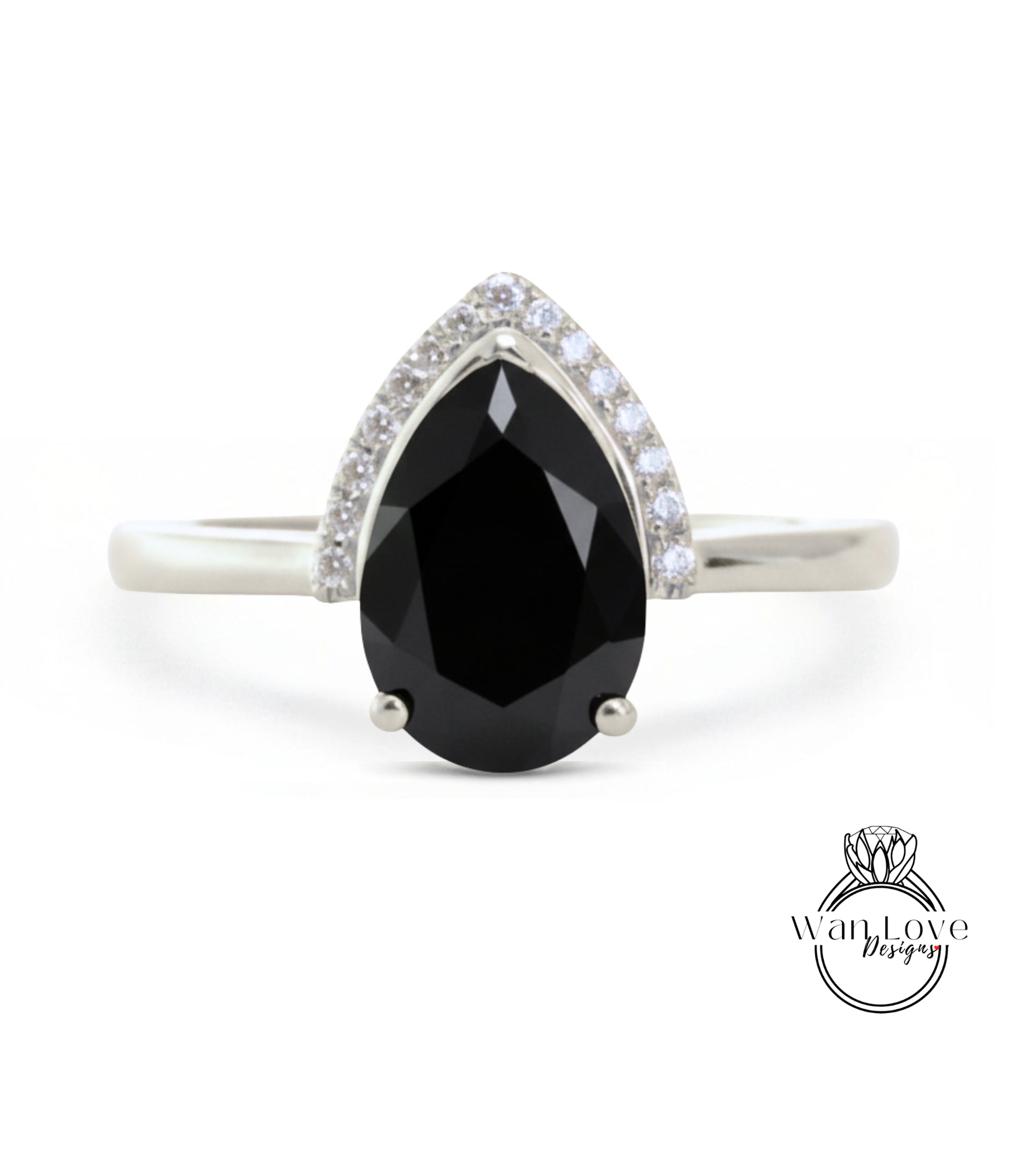 A silver ring with a large black diamond as the centerpiece, surrounded by smaller diamonds.