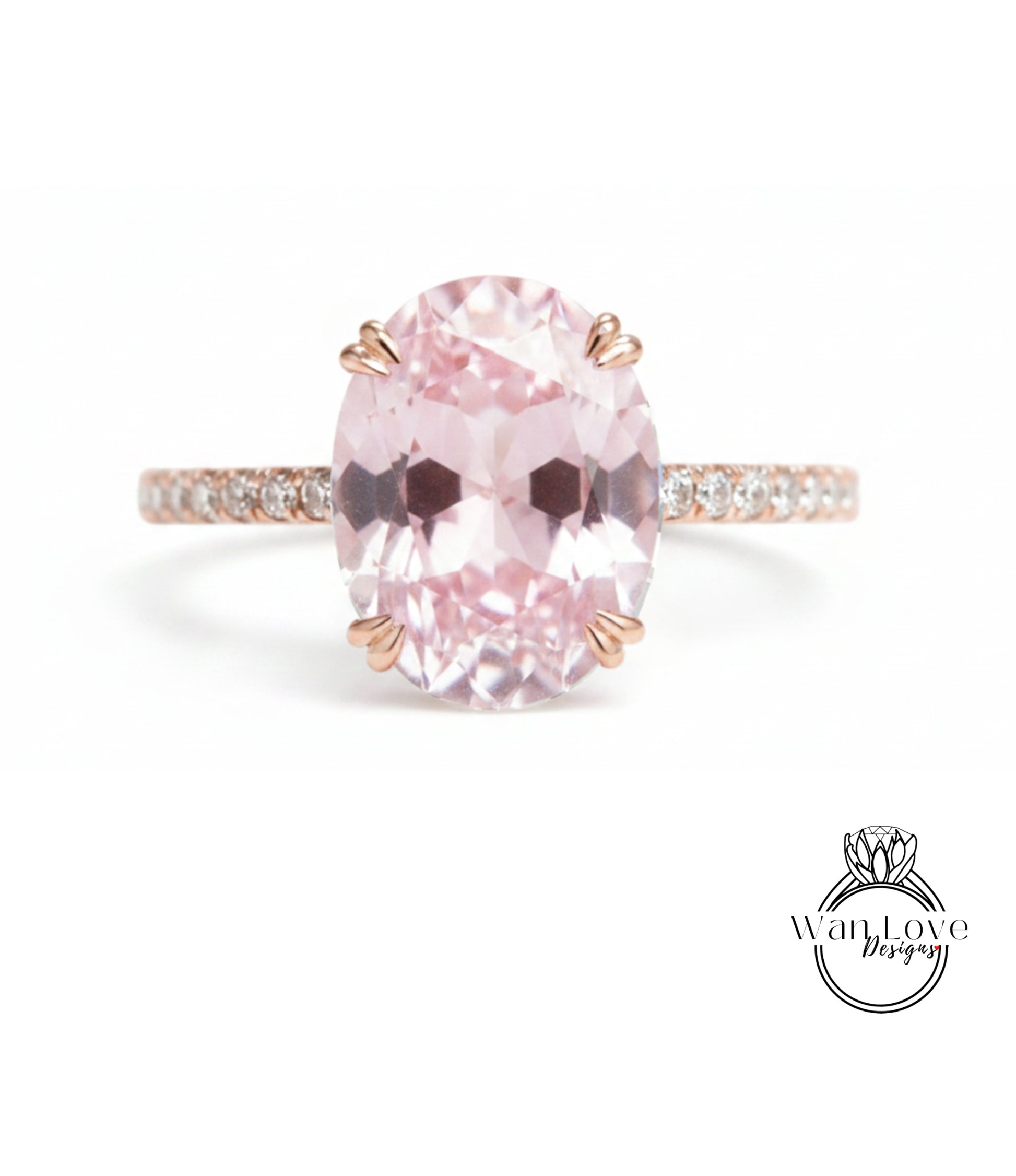 A pink gemstone engagement ring with a large oval-shaped gemstone set in a rose gold band.