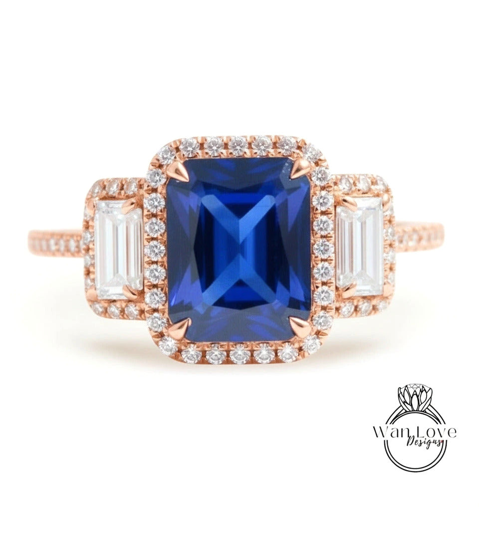 A close-up image of a beautiful blue gemstone ring with a halo of smaller diamonds around it, set in a rose gold band.