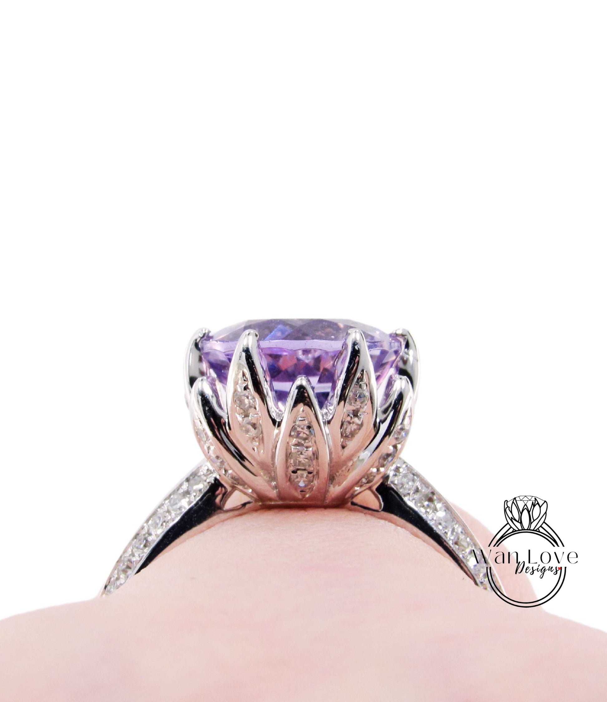 A close-up view of a silver ring with a large purple gemstone, showcasing the intricate design and craftsmanship.