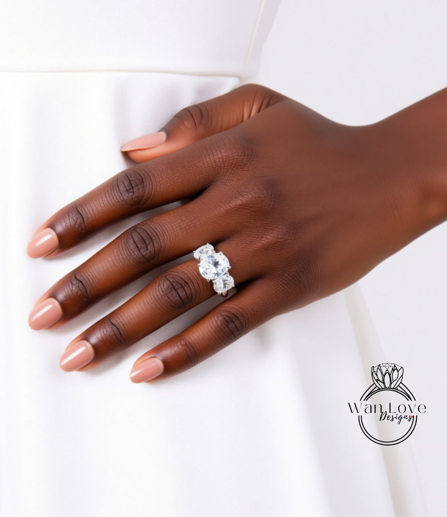 A close-up of a hand wearing a large diamond engagement ring.