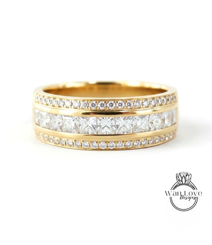 A gold band ring with a row of diamonds set in the center, showcasing a beautiful and elegant design.