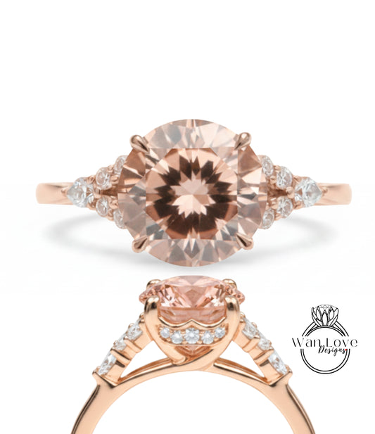 a beautiful rose gold engagement ring with a large oval-shaped gemstone set in the center. The ring is adorned with smaller diamonds around the gemstone, creating a stunning and elegant design.